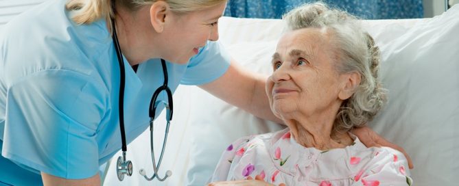 Nurse cares for a elderly woman lying in bed skilled nursing care