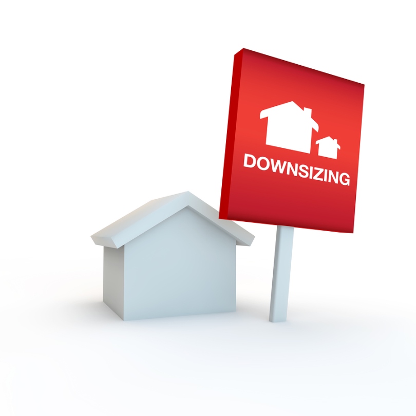 red sign on a white background with house concept of downsizing