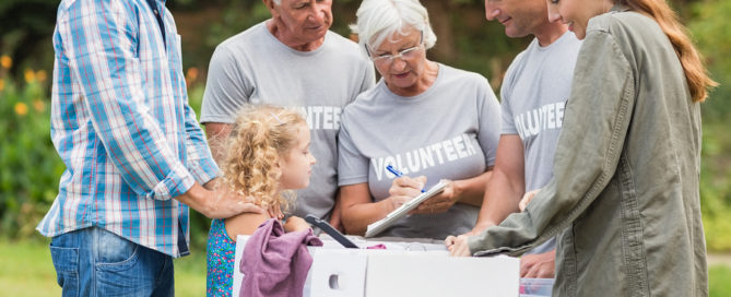 senior volunteers separating donations stuff