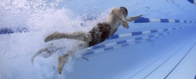 a man swimming laps in a pool