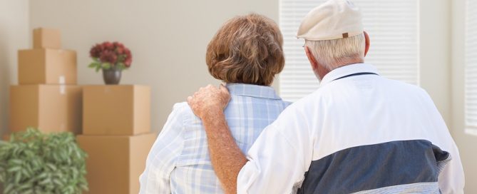 moving to a CCRC older couple with moving boxes