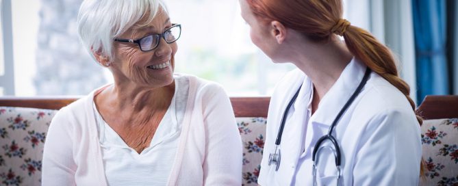 CCRC healthcare center quality Senior woman and female doctor in living room of a home