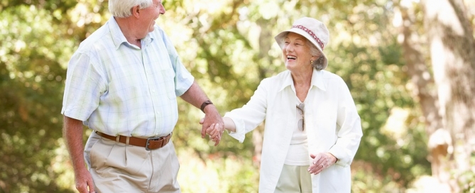 future of senior living older couple outdoors holding hands