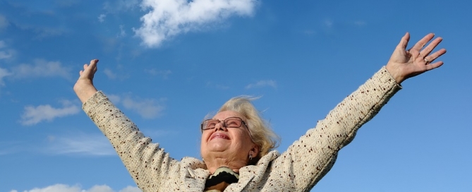 aging independently happy older woman standing outside