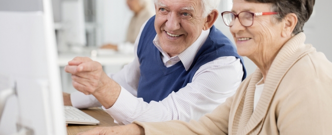 lifelong learning seniors looking at a computer