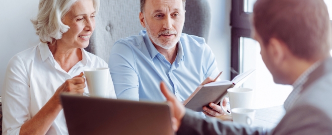 financial planner with clients senior living sales plan