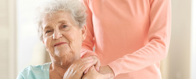 Woman hugging old woman