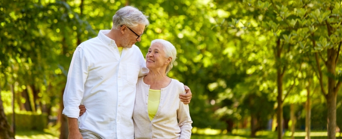 older couple walking in the park