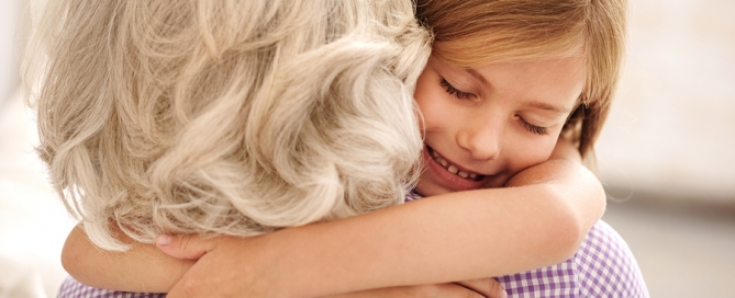 granddaughter hugging grandmother