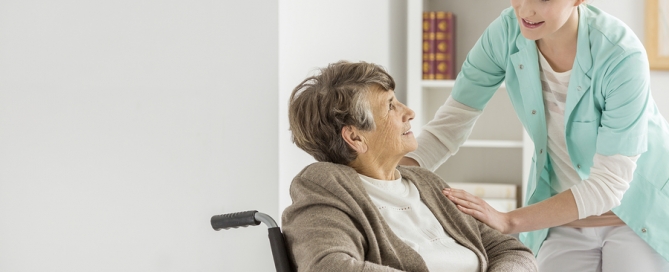 Caregiver helping elderly woman In her Home