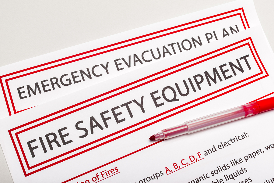 Emergency evacuation plan and fire safety equipment signs