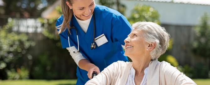 elderly woman with her caregiver at nursing home