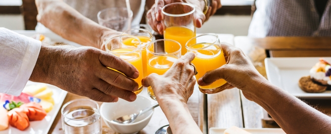 CCRCs dining facilities group of people eat breakfast in a restaurant