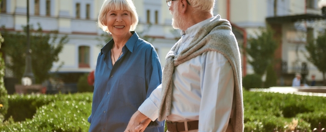 elderly couple holding hands; equity CCRC and rental CCRC