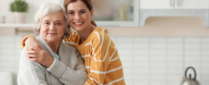 family caregiving Elderly Woman With Female Caregiver In Kitchen