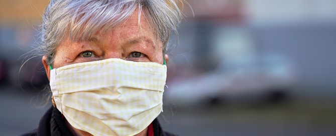 Elderly Senior Woman Wearing Home Made Cloth Facemask covid senior living sentiment