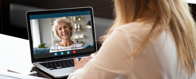 senior woman making video call with teenager remote learning tutoring program