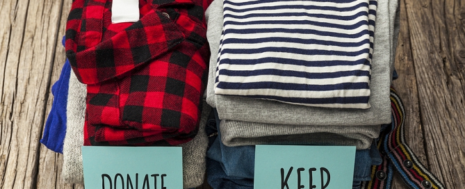 Stack Of Old Clothes To Discard or Keep decluttering for senior living move