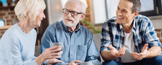 How to Constructively Talk with Parents About Senior Housing Options adult child talking to parents