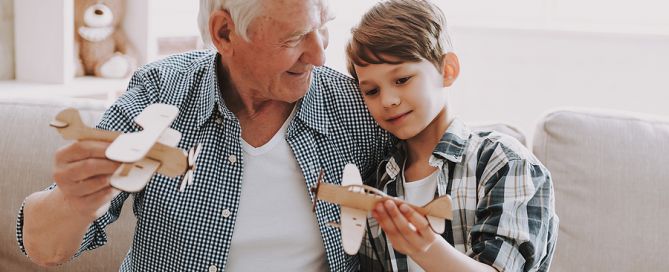 Portrait Grandpa And Grandson Playing With Toys_ sense of purpose