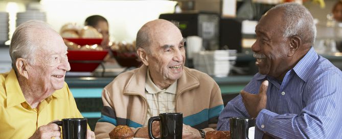 Senior men drinking tea together; new friends