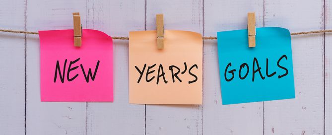 New Year's Goals Text On Colorful Paper new year's resolutions