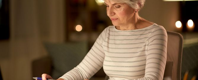 senior woman with calculators; CCRC cost affordability