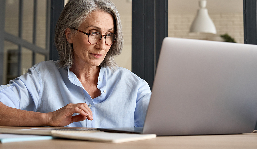 Senior lady looking at the MoneyGauge financial fit tool on her computer