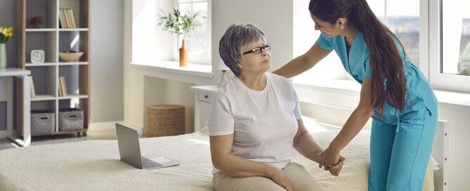 LTC staffing shortage; nurse helping older woman