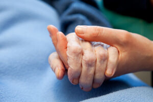Holding Hand of an Elderly person elder guardianship legal documents