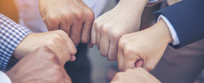 Multiethnic Hands Together Teamwork team of professional services providers