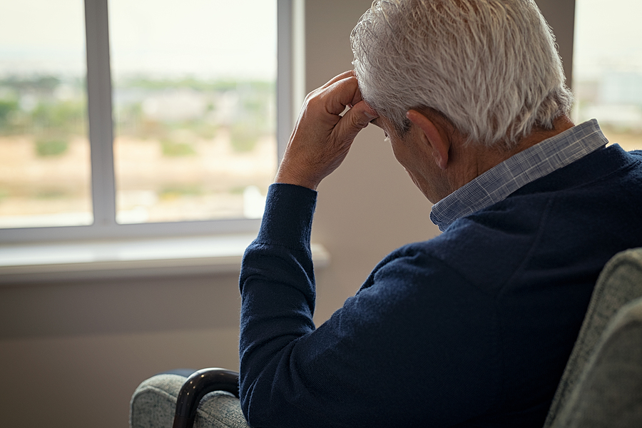 old man sitting on armchair in living room senior suicide
