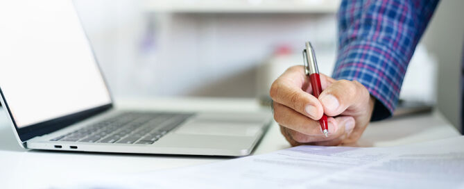 Businessman Using Laptop Computer. Senior Living Marketing and Sales Process