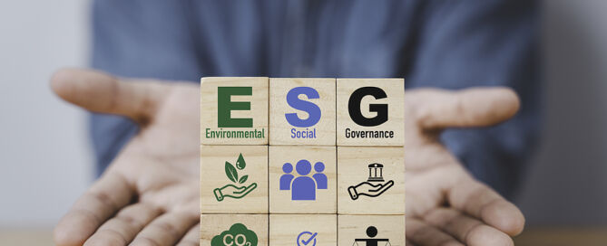 hands with ESG wording on wooden cube block Environment Social Governance concept. ESG senior living