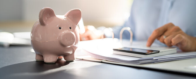 woman with calculaor and Piggybank ; How should I pay the CCRC entry fee