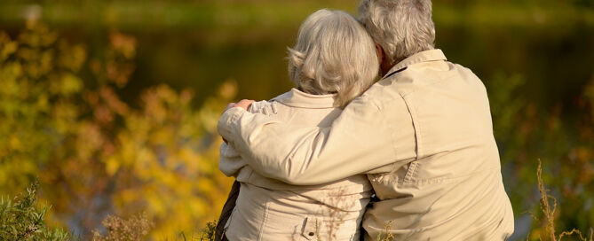 Elderly couple sitting on the grass in autumn. I'm not ready yet 55 Plus Community Prospects