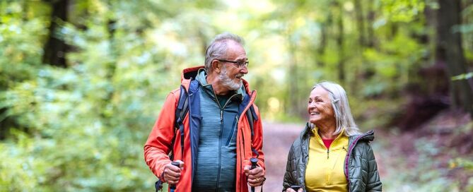 Happy Senior Couple Hiking In Autumn Forest best places to retire top places to retire
