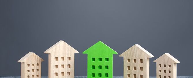 Green Figure Of A Residential Building Stands Out Among Rest Of Houses. green retirement community