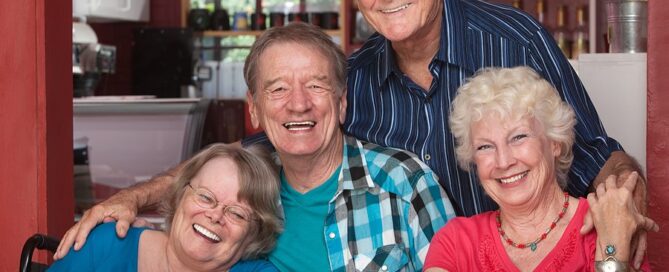 Laughing Seniors In Cafe benefits of a retirement community