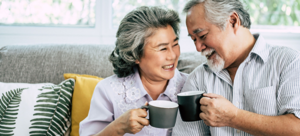 moving to a retirement community ; couple drinking coffee together