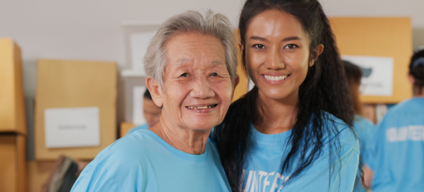 Shutterstock_1760086277 difference between nonprofit and not-for-profit young woman and older woman volunteers
