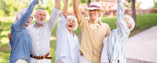 group of happy older adults in a park; I wish I’d moved sooner