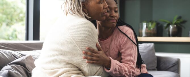 African,American mother and her adult Daughter,Sitting,On a sofa; quality of life