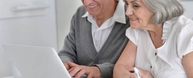 older adult Couple,With,A,Laptop; senior living decision journey