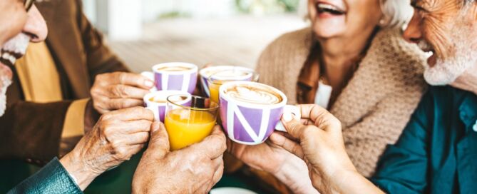 Senior,People,Group,Toasting,Latte,At,Coffee,shop; sense of community