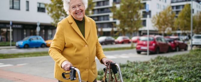 Senior,Woman,With,A,Mobility,Walker,Walking,On,City,Streets; Assistive Walking Device; walking aid