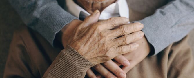 helping elderly parent; Hugging,A,Senior,Man,At,Home; assisted living