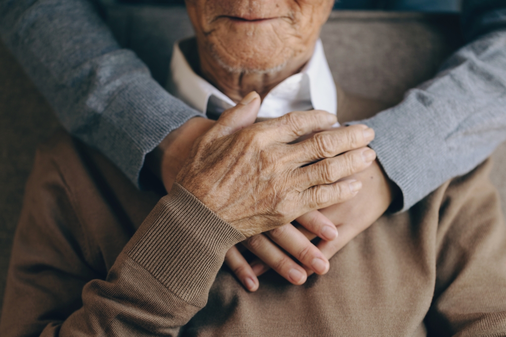helping elderly parent; Hugging,A,Senior,Man,At,Home; assisted living